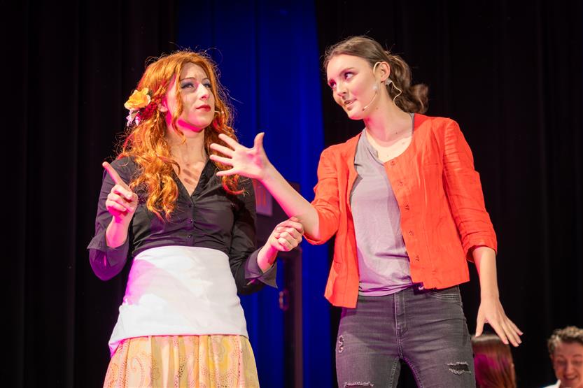 Students perform onstage